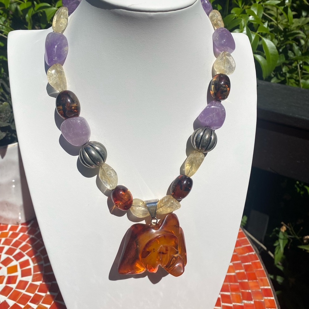 Baltic Amber carved rose sterling silver pendant.